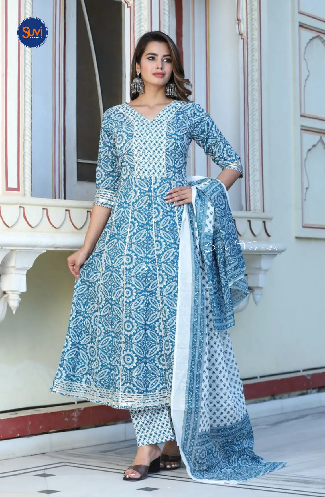 This stunning Cotton Printed Anarkali Suit Set in Navy Blue exudes elegance and style. Its V-neck and 3/4 sleeve design, paired with delicate Kota pati work, is perfect for any occasion. Made from high-quality cotton, this set comes with pants and a dupatta. Elevate your wardrobe and buy online from Malaysia now!