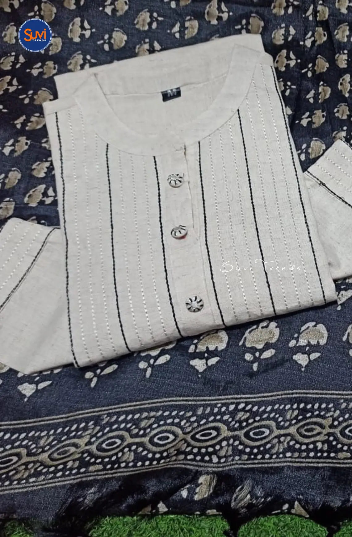 Add a touch of elegance to your wardrobe with our Cotton Pintuck Suit Set in Off White. Made from soft and breathable cotton, this suit set features a mandarin collar and pin tuck detailing for a sophisticated look. The 3/4 sleeves and straight cut add a modern flair, making it perfect for any occasion. Complete the ensemble with the included pant and dupatta. Available online in Malaysia.