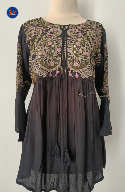 Elevate your ethnic wardrobe with our Embroidered Cotton Kurti with Tassels. Made of soft cotton with intricate embroidery, this short kurti features bell sleeves and a flattering peplum cut. Perfect for any occasion, get yours now at the best price!