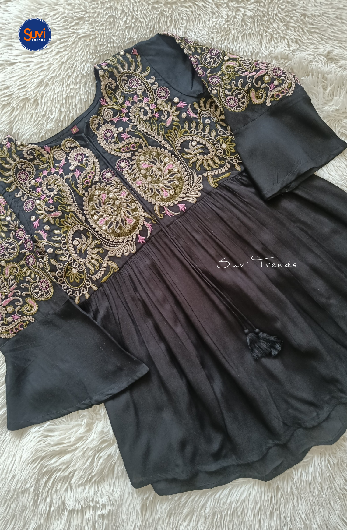 Elevate your ethnic wardrobe with our Embroidered Cotton Kurti with Tassels. Made of soft cotton with intricate embroidery, this short kurti features bell sleeves and a flattering peplum cut. Perfect for any occasion, get yours now at the best price!