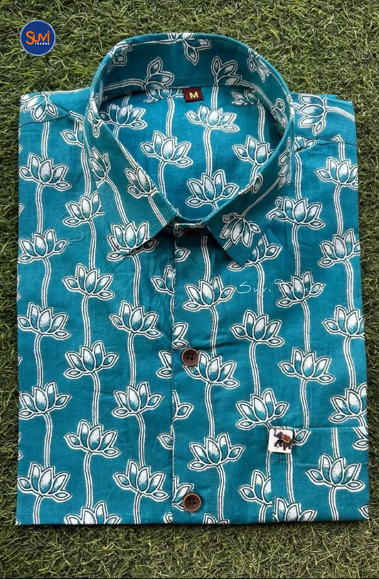 Expertly crafted from premium pure cotton, this men's shirt features a mesmerizing lotus print and a classic collared neck. With its versatile half sleeve design, this shirt is perfect for both casual and dressy occasions. Add a touch of unique style to your wardrobe and buy online now from Malaysia.